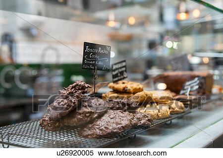 Cafe display cabinet with stacked cookies and biscuits View Large Photo Image Stock Photography - Cafe display cabinet with stacked cookies and biscuits. Fotosearch
