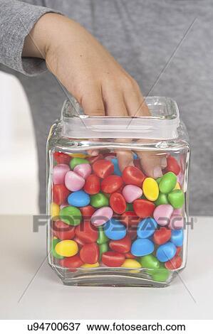 Child taking sweets View Large Photo Image Stock Photo - Child taking sweets. Fotosearch