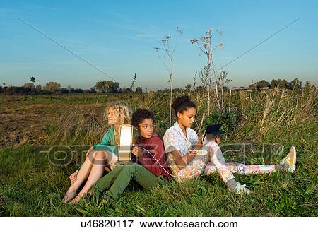 Children using miniature solar cell to power digital tablet, Breda, Netherlands View Large Photo Image Stock Photo - Children using miniature solar cell to power digital tablet, Breda, Netherlands. Fotosearch