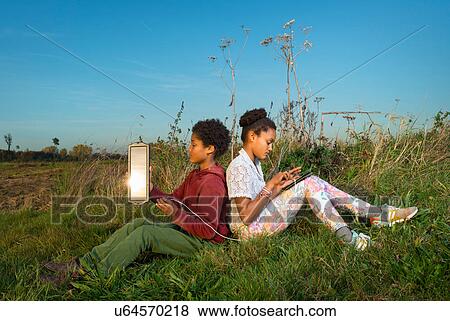 Children using miniature solar cell to power digital tablet, Breda, Netherlands View Large Photo Image Stock Photo - Children using miniature solar cell to power digital tablet, Breda, Netherlands. Fotosearch