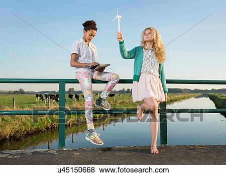 Children using miniature wind turbine to power digital tablet, Breda, Netherlands View Large Photo Image Stock Photo - Children using miniature wind turbine to power digital tablet, Breda, Netherlands. Fotosearch