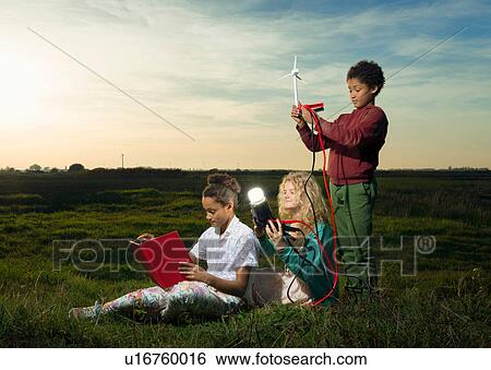 Children using miniature wind turbine to power light bulb, Breda, Netherlands View Large Photo Image Stock Photograph - Children using miniature wind turbine to power light bulb, Breda, Netherlands. Fotosearch