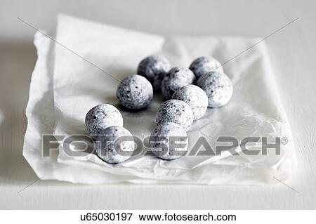 Stock Photo - Chocolate and champagne truffles on white napkin. Fotosearch