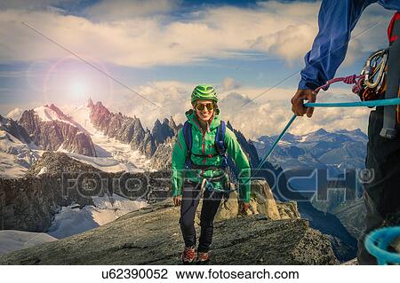 Climbing couple climbing ridge at Mont Savoie, France View Large Photo Image Stock Image - Climbing couple climbing ridge at Mont Savoie, France. Fotosearch