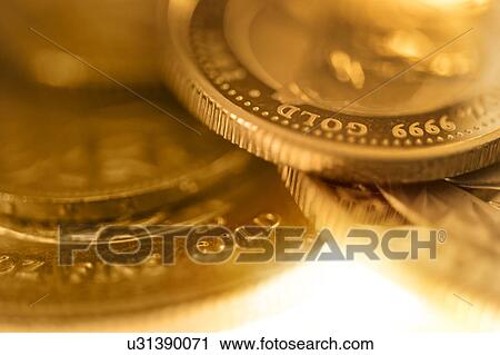 Stock Image - Close-up of gold coins. Fotosearch