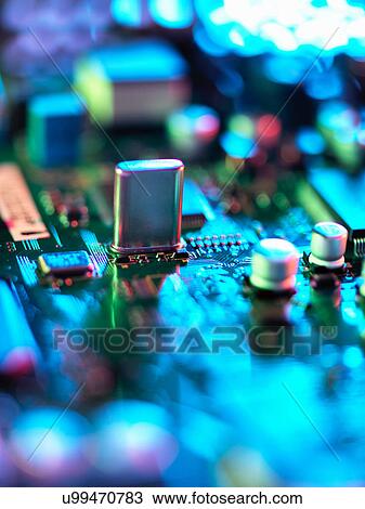 Stock Image - Close up of hi-tech electronic circuit board. Fotosearch