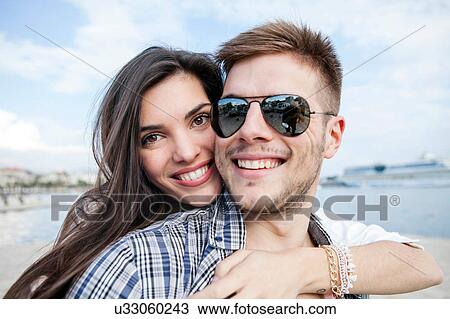 Close up portrait of couple hugging on harbour, Split, Dalmatia, Croatia View Large Photo Image Stock Image - Close up portrait of couple hugging on harbour, Split, Dalmatia, Croatia. Fotosearch