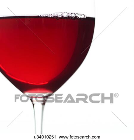 Stock Image - Close-up view of glass of red wine. Fotosearch