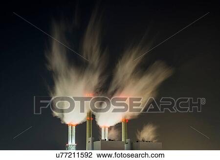 Stock Image - Coal fired power station at night. Fotosearch