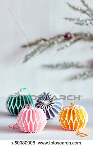 Stock Photo - Colourful Christmas baubles with colour coordinated ribbon. Fotosearch