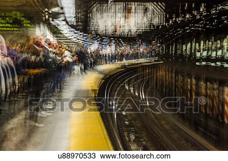 Stock Image - Commuters in NYC subway system. Fotosearch