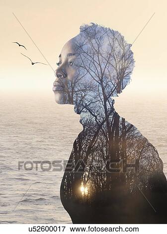 Stock Photo - Composite image of woman, forest and seascape. Fotosearch