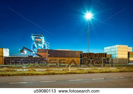 Stock Image - Containers stacked in terminal at Rotterdam harbour, Netherlands. Fotosearch