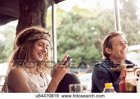 Stock Photo - Couple at sidewalk cafe, Cape Town, South Africa. Fotosearch
