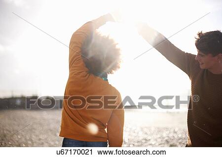 Couple dancing on beach View Large Photo Image Stock Image - Couple dancing on beach. Fotosearch