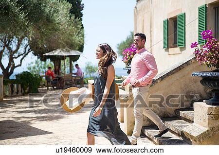 Stock Photo - Couple on stairway at boutique hotel, Majorca, Spain. Fotosearch
