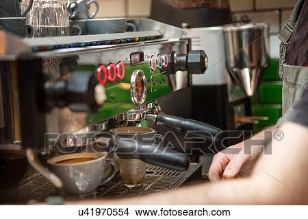 Picture - Cropped shot of barista preparing coffee in cafe. Fotosearch
