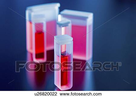 Stock Image - Cuvettes containing red samples. Fotosearch