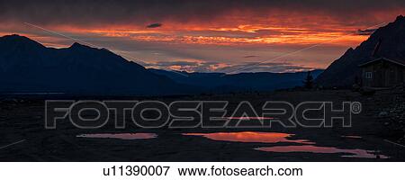 Stock Photo - Denali Highway, Route 8, offers sunset views of Mt. Deborah, Mnt. Hess Mountain, & Mt. Hayes Alaska, Alaska. Fotosearch