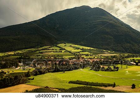 Stock Image - Distant view of village in Vinschgau Valley, South Tyrol, Italy. Fotosearch