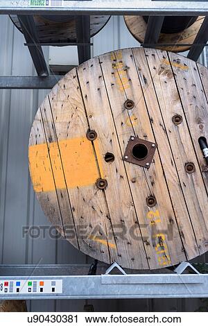 Stock Image - Electrical cable reel at cable storage facility. Fotosearch