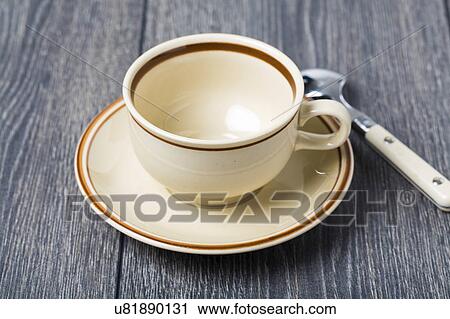Stock Image - Empty coffee cup and saucer. Fotosearch