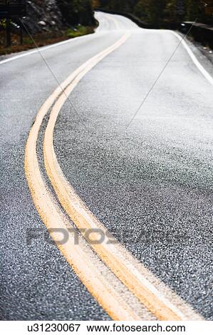 Stock Photo - Empty mountain road. Fotosearch