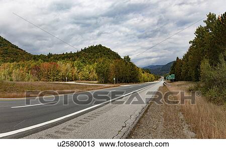 Stock Image - Empty road, New Hampshire, USA. Fotosearch