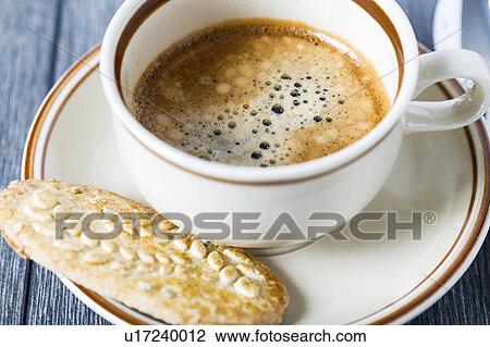Espresso in coffee cup with biscuit View Large Photo Image Stock Image - Espresso in coffee cup with biscuit. Fotosearch