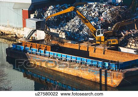Stock Image - Excavator at garbage dump. Fotosearch