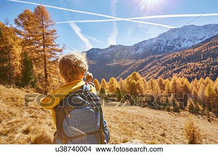 Family hiking, rear view, Schnalstal, South Tyrol, Italy View Large Photo Image Picture - Family hiking, rear view, Schnalstal, South Tyrol, Italy. Fotosearch
