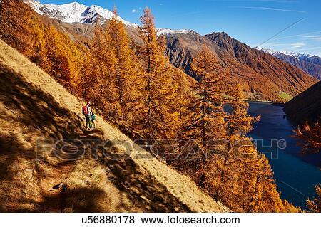 Stock Photo - Family looking at view, Schnalstal, South Tyrol, Italy. Fotosearch