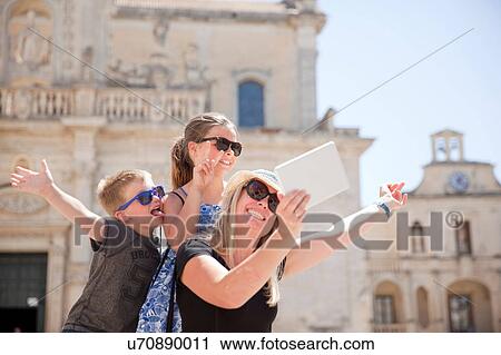 Family posing for selfie, Piazza del Duomo, Lecce, Italy View Large Photo Image Stock Image - Family posing for selfie, Piazza del Duomo, Lecce, Italy. Fotosearch