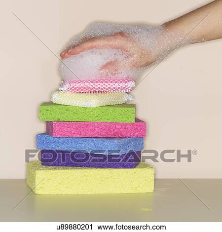 Female hand covered in foam on stack of sponges View Large Photo Image Stock Image - Female hand covered in foam on stack of sponges. Fotosearch
