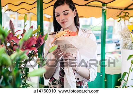 Female tourist with bunch of flowers at market stall, Split, Dalmatia, Croatia View Large Photo Image Stock Image - Female tourist with bunch of flowers at market stall, Split, Dalmatia, Croatia. Fotosearch