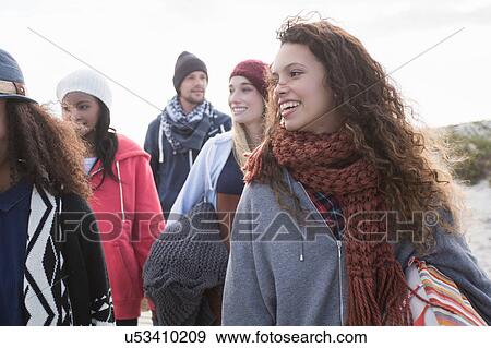 Stock Photo - Five young adult friends strolling along beach, Western Cape, South Africa. Fotosearch