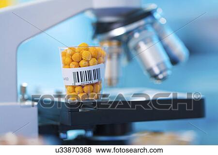 Stock Photo - Food sample and microscope. Fotosearch