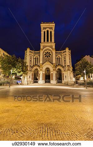 Stock Photo - France, Auvergne-Rhone-Alpes, Saint-Etienne, Saint-Charles-de-Borrome Cathedral at night. Fotosearch