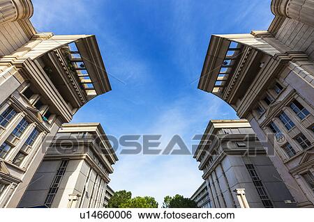 Stock Photograph - France, Occitanie, Montpellier, Low angle view of modern architecture of Quartier Antigone. Fotosearch