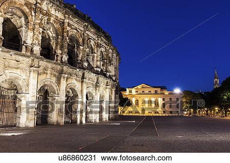 France, Occitanie, Nimes, Arena of Nimes at dusk View Large Photo Image Stock Image - France, Occitanie, Nimes, Arena of Nimes at dusk. Fotosearch
