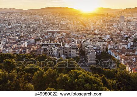 Stock Image - France, Provence-Alpes-Cote d'Azur, Marseille, Cityscape at dusk. Fotosearch