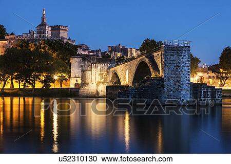 Stock Image - France, Provence-Alpes-Cote d'Azur, Avignon, Old town, embankment in foreground. Fotosearch