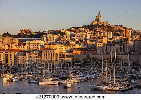 France, Provence-Alpes-Cote d'Azur, Marseille, Notre-Dame de la Garde above Vieux port - Old Port View Large Photo Image Stock Photo - France, Provence-Alpes-Cote d'Azur, Marseille, Notre-Dame de la Garde above Vieux port - Old Port. Fotosearch