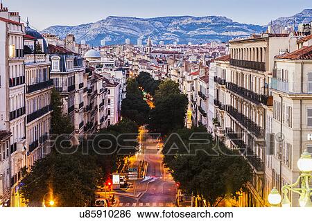 France, Provence-Alpes-Cote d'Azur, Marseille, Street in city, mountain in background View Large Photo Image Stock Photograph - France, Provence-Alpes-Cote d'Azur, Marseille, Street in city, mountain in background. Fotosearch