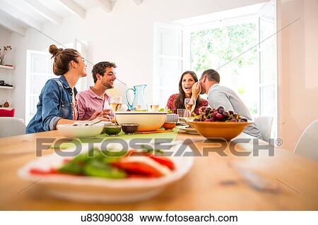 Stock Photo - Friends dining together. Fotosearch