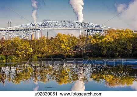 Stock Image - George C. Platt Memorial Bridge and refinery smokestack, South of Philadelphia, PA. Fotosearch