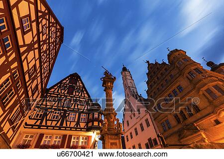 Stock Image - Germany, Bavaria, Rothenburg, Low angle view of half-timbered houses at Market Square. Fotosearch