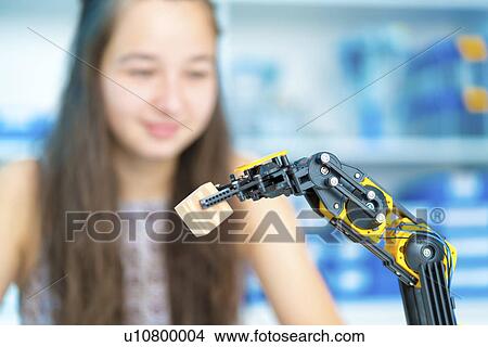 Girl controlling robot View Large Photo Image Picture - Girl controlling robot. Fotosearch