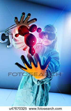 Stock Photography - Girl in virtual reality headset interacting with digital floating blood globules. Fotosearch