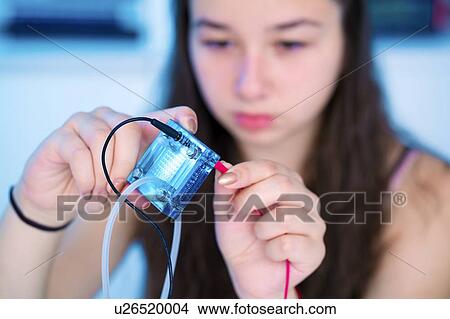 Girl testing proton exchange membrane cell View Large Photo Image Picture - Girl testing proton exchange membrane cell. Fotosearch